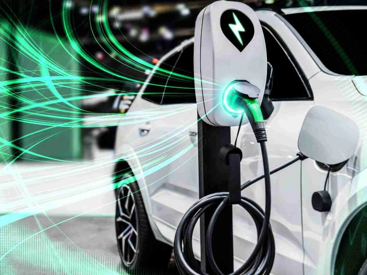 Electric vehicle connected to a charging point